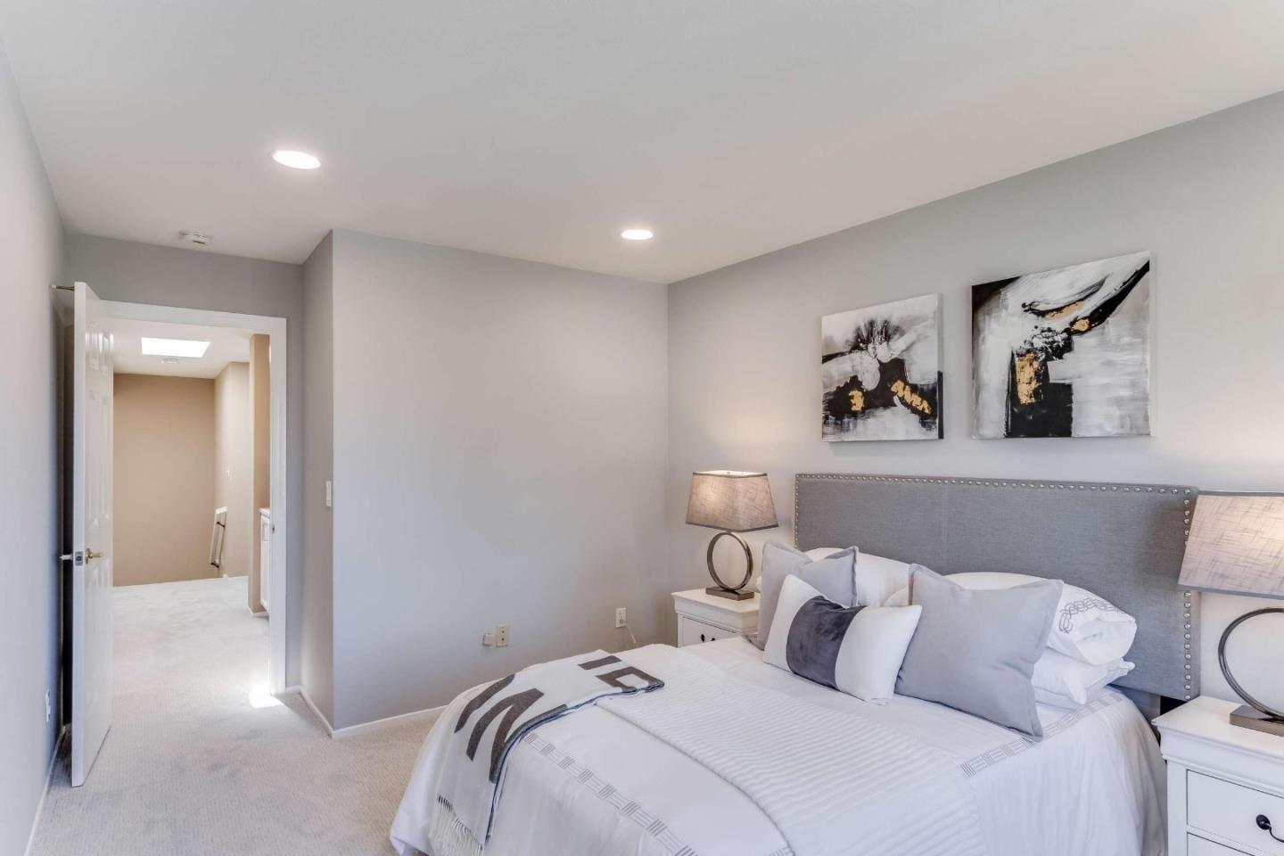 11627 Cedar Spring Court Cupertino, CA 95014 - Photo 27 of 54 a bedroom with a bed and painting on the wall