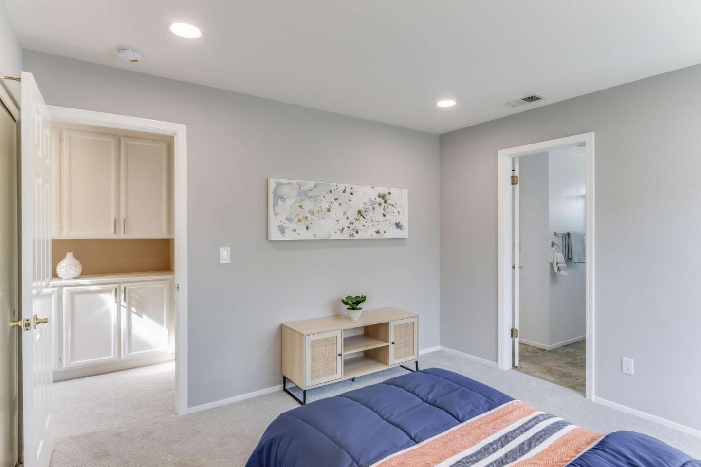 11627 Cedar Spring Court Cupertino, CA 95014 - Photo 29 of 54 a living room with a bed and a view of kitchen