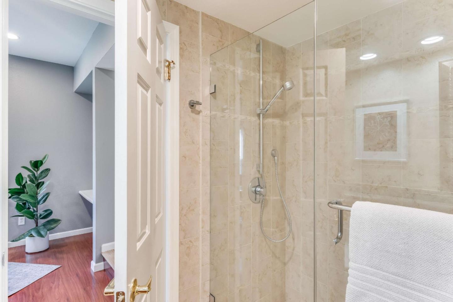 11627 Cedar Spring Court Cupertino, CA 95014 - Photo 31 of 54 a bathroom with a shower curtain