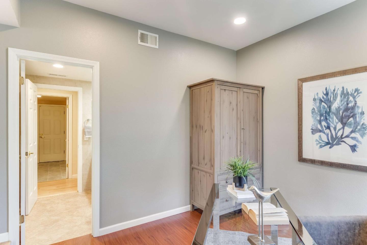 11627 Cedar Spring Court Cupertino, CA 95014 - Photo 34 of 54 a workspace with furniture and wooden floor