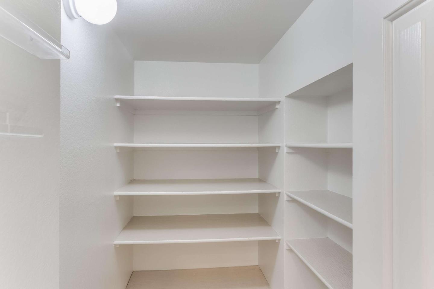 11627 Cedar Spring Court Cupertino, CA 95014 - Photo 37 of 54 a view of walk in closet with empty racks