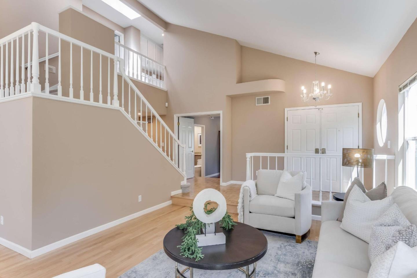 11627 Cedar Spring Court Cupertino, CA 95014 - Photo 4 of 54 a living room with furniture and a table