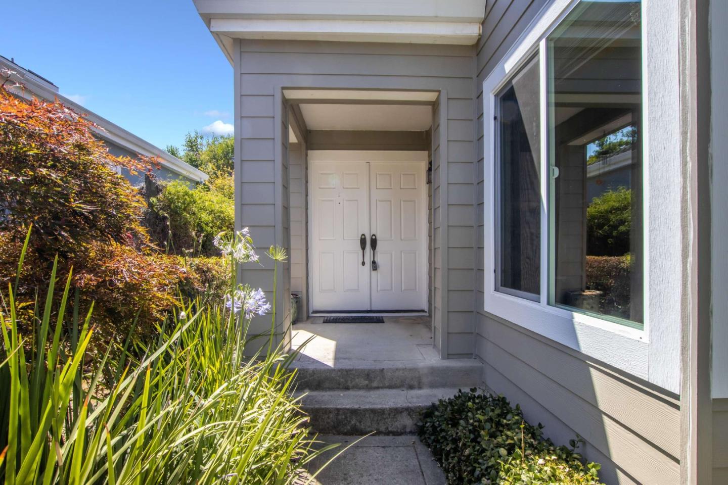 11627 Cedar Spring Court Cupertino, CA 95014 - Photo 43 of 54 a front view of a house with a yard