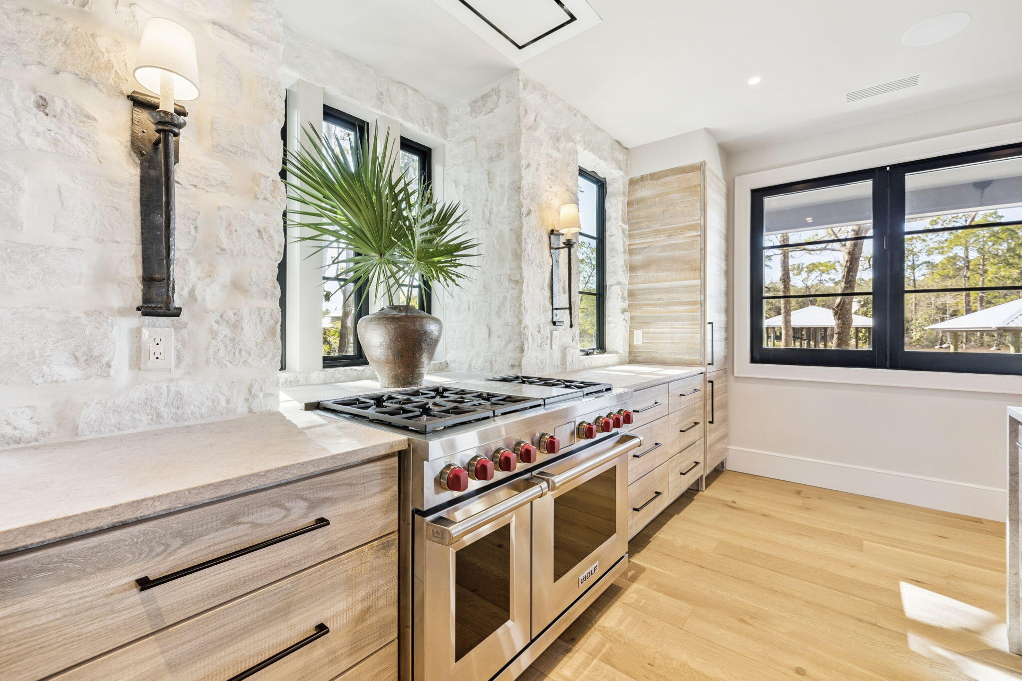 613 Eden Drive Point Washington, FL 32459 - Photo 14 of 81 a kitchen with stainless steel appliances a stove and a window