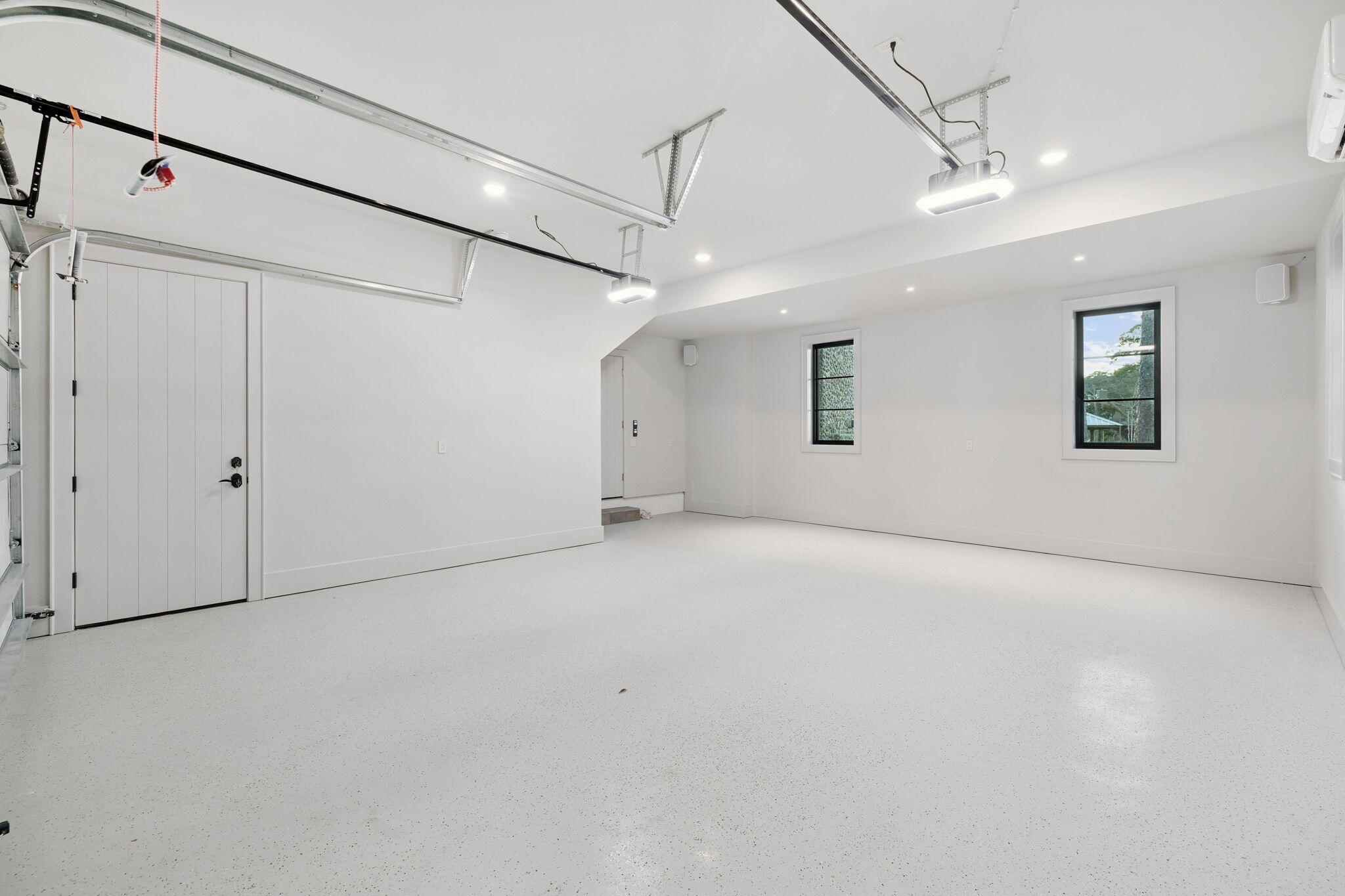 613 Eden Drive Point Washington, FL 32459 - Photo 23 of 81 a view of a big room with ceiling fan and windows