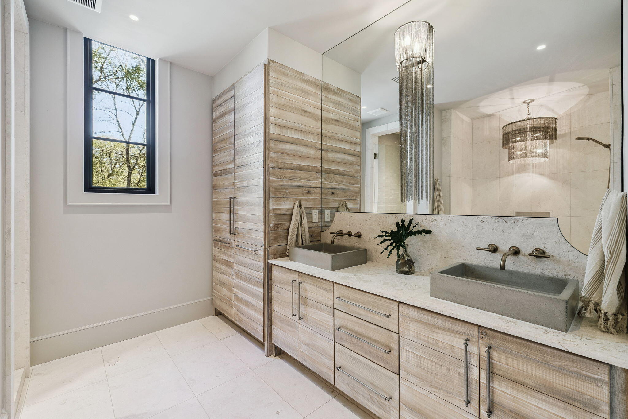 613 Eden Drive Point Washington, FL 32459 - Photo 25 of 81 a bathroom with a double vanity sink a mirror and a shower