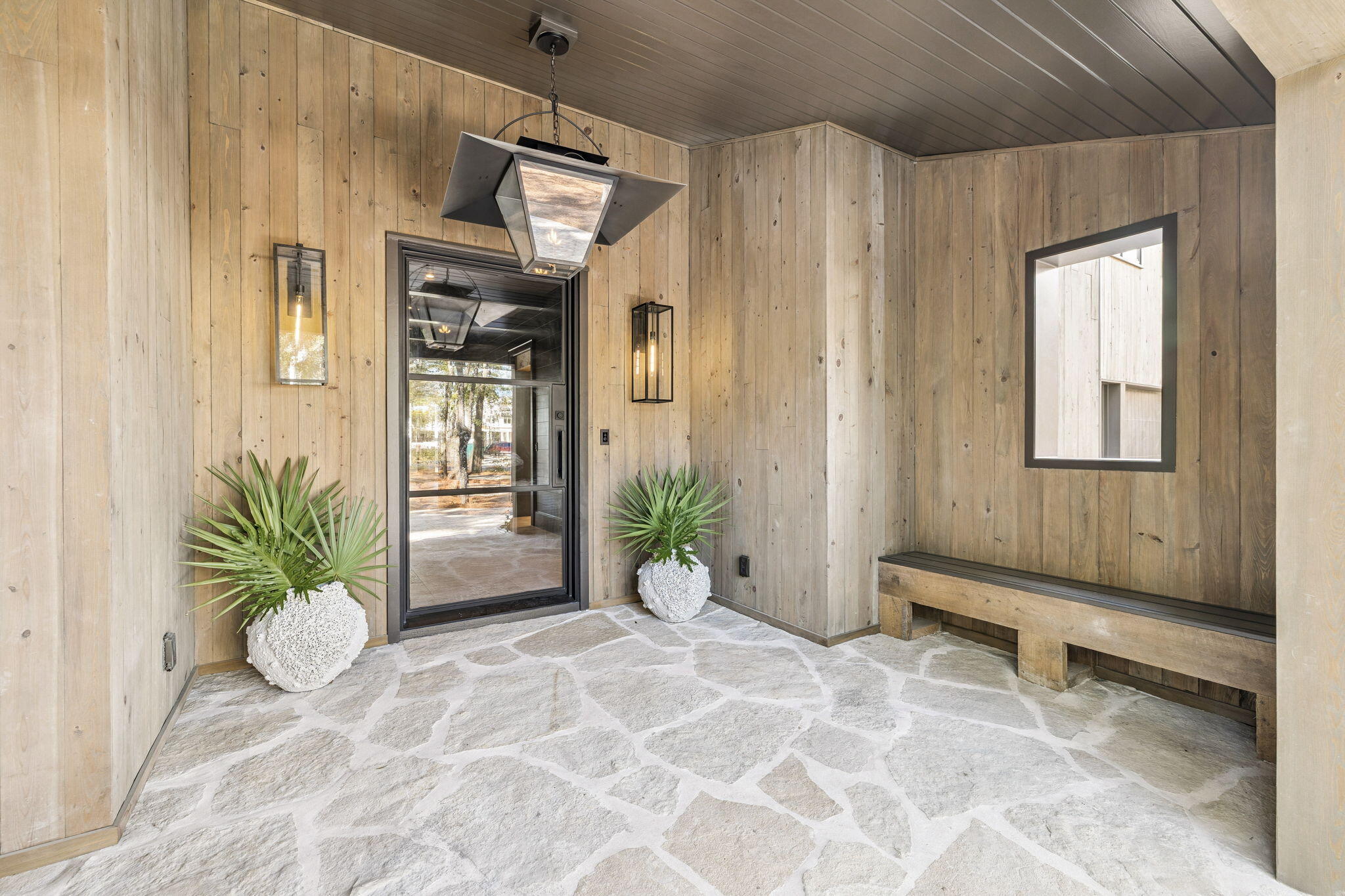 613 Eden Drive Point Washington, FL 32459 - Photo 6 of 81 a view of an entryway with wooden floor and a potted plant