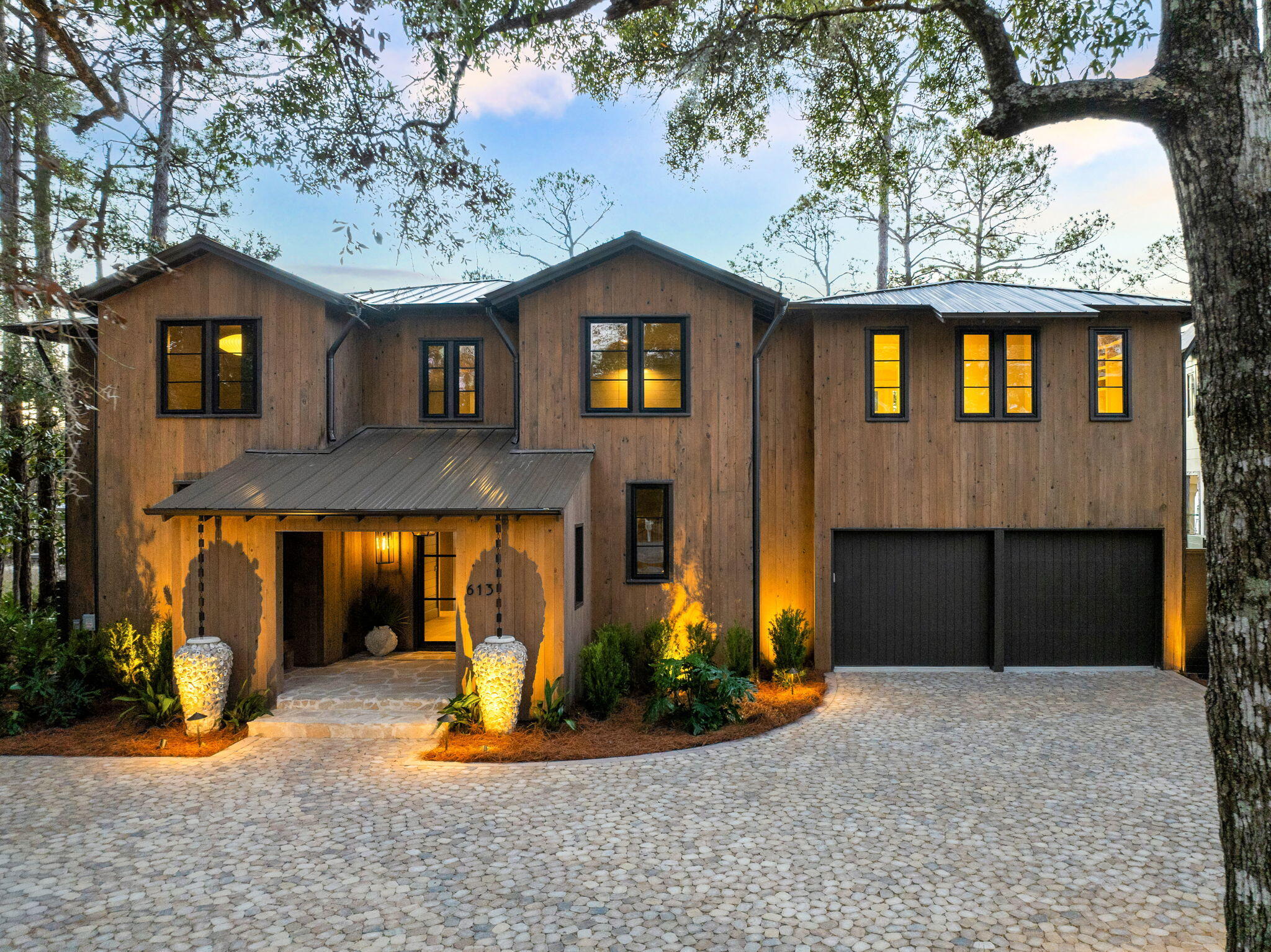 613 Eden Drive Point Washington, FL 32459 - Photo 78 of 81 a front view of a house with a yard and garage