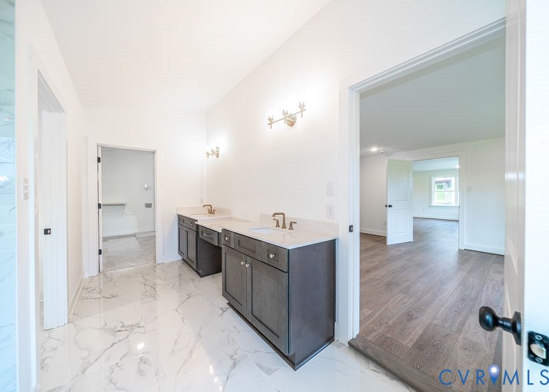 281 Petersburg Road Powhatan, VA 23139 - Photo 21 of 38 Bathroom featuring double vanity and light marble