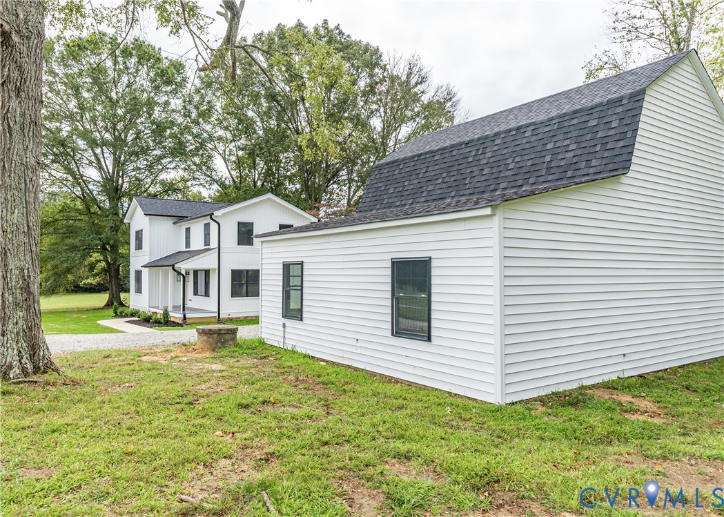 281 Petersburg Road Powhatan, VA 23139 - Photo 35 of 38 View of side of home featuring roof with shingles,
