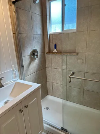 a bathroom with a sink and a shower