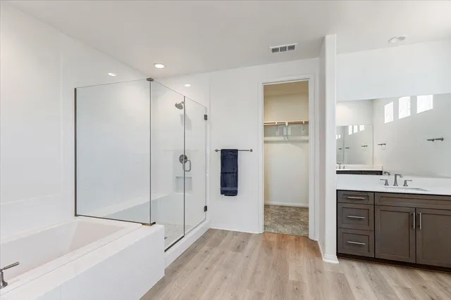 a bathroom with a bathtub and a sink