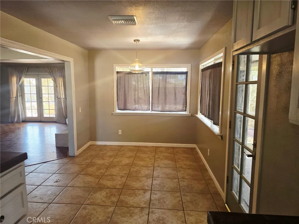 20221 Modoc Road Apple Valley, CA 92308 - Photo 6 of 23 an empty room with windows