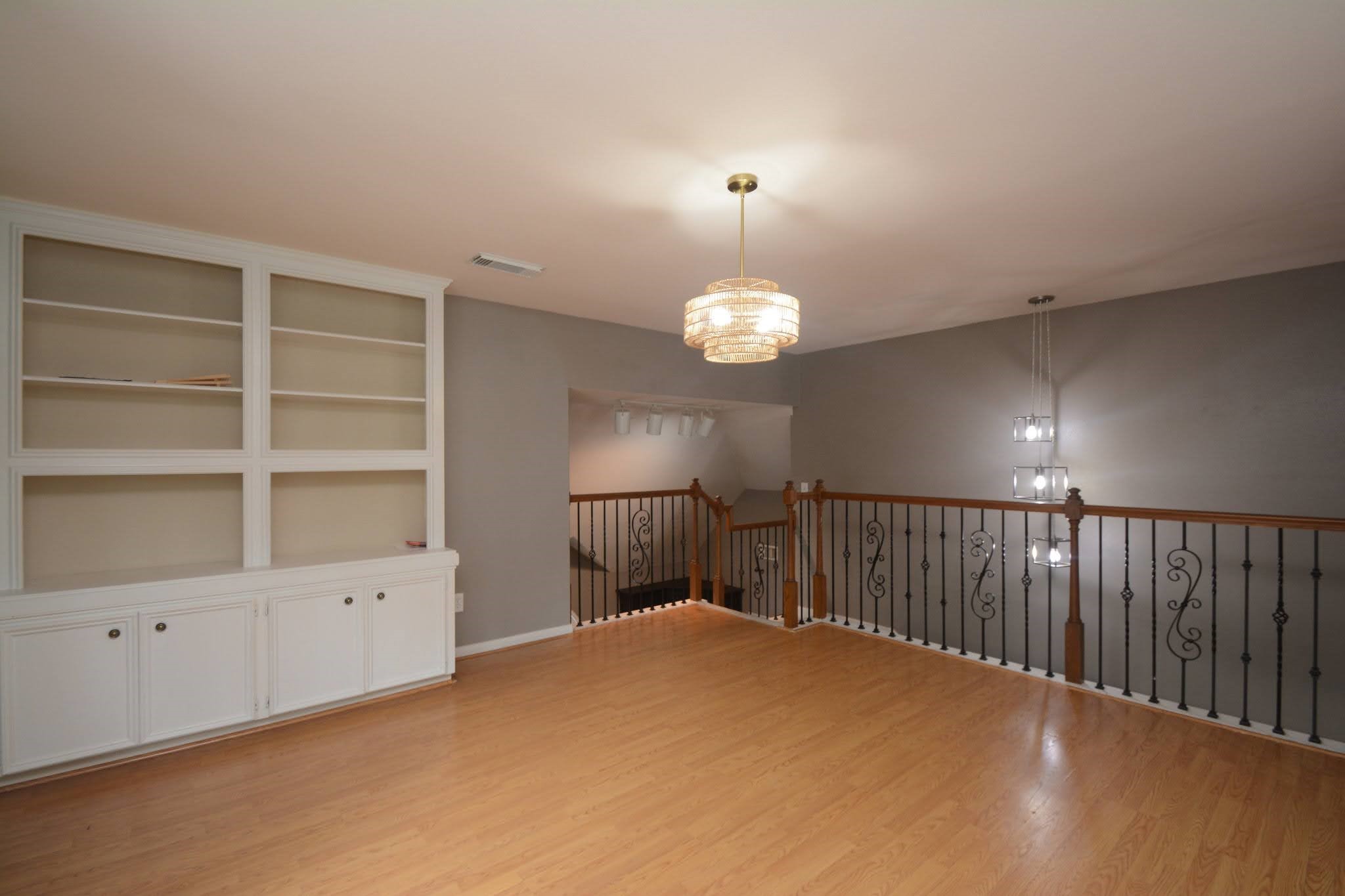 14955 Inverrary Drive Houston, TX 77095 - Photo 26 of 46 Upstairs gameroom with built-in shelving