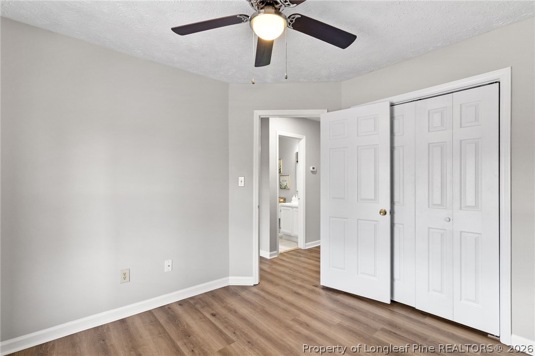 388 Woodwind Drive Spring Lake, NC 28390 - Photo 24 of 31 wooden floor in an empty room with a window