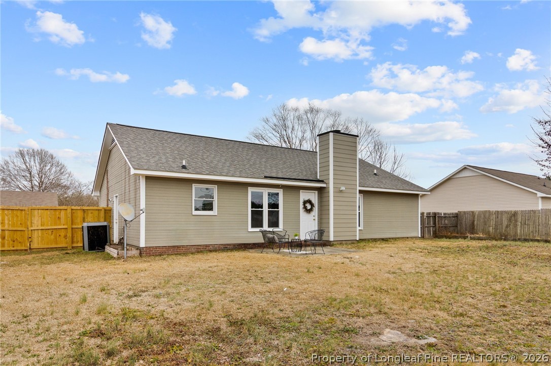 388 Woodwind Drive Spring Lake, NC 28390 - Photo 27 of 31 a front view of house with garage and yard
