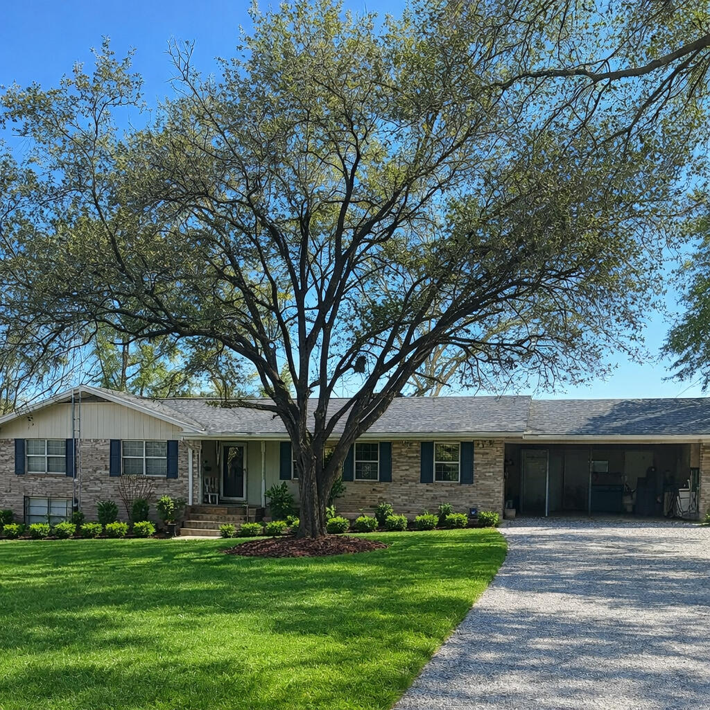 a front view of a house with a garden