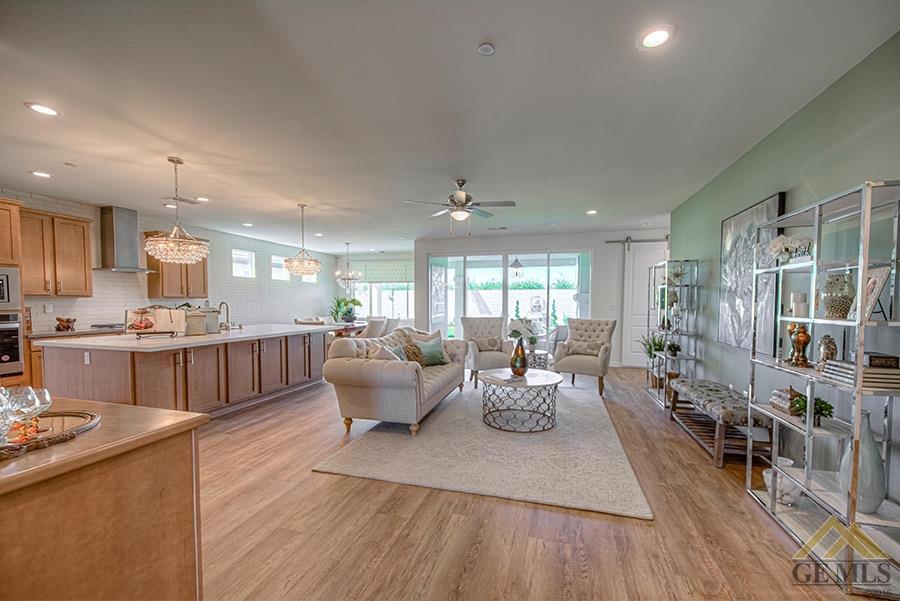 Undisclosed Address Bakersfield, CA 93311 - Photo 2 of 9 a living room with furniture and a large window