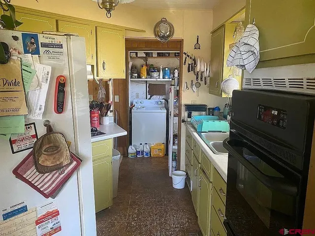 a view of a entryway with furniture and chandelier
