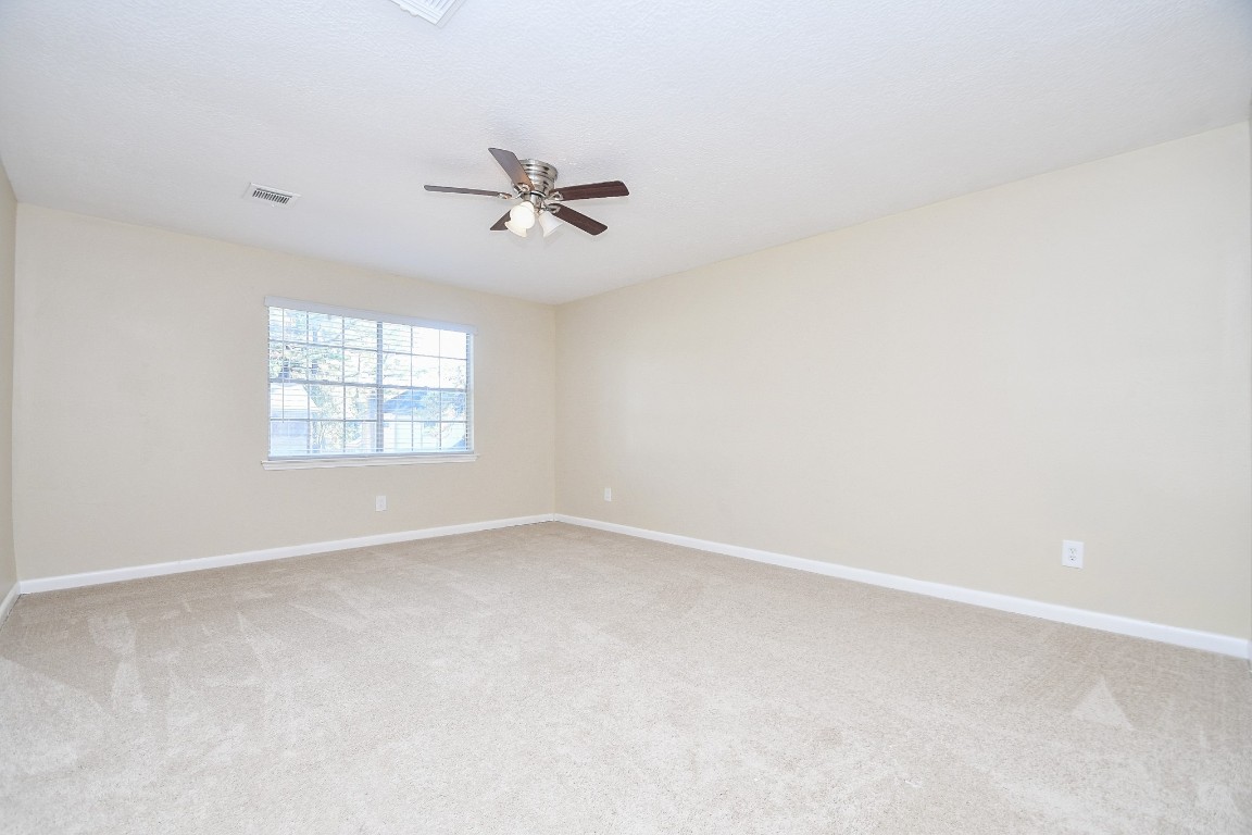4730 Theall Road Houston, TX 77066 - Photo 14 of 32 a view of an empty room with a window