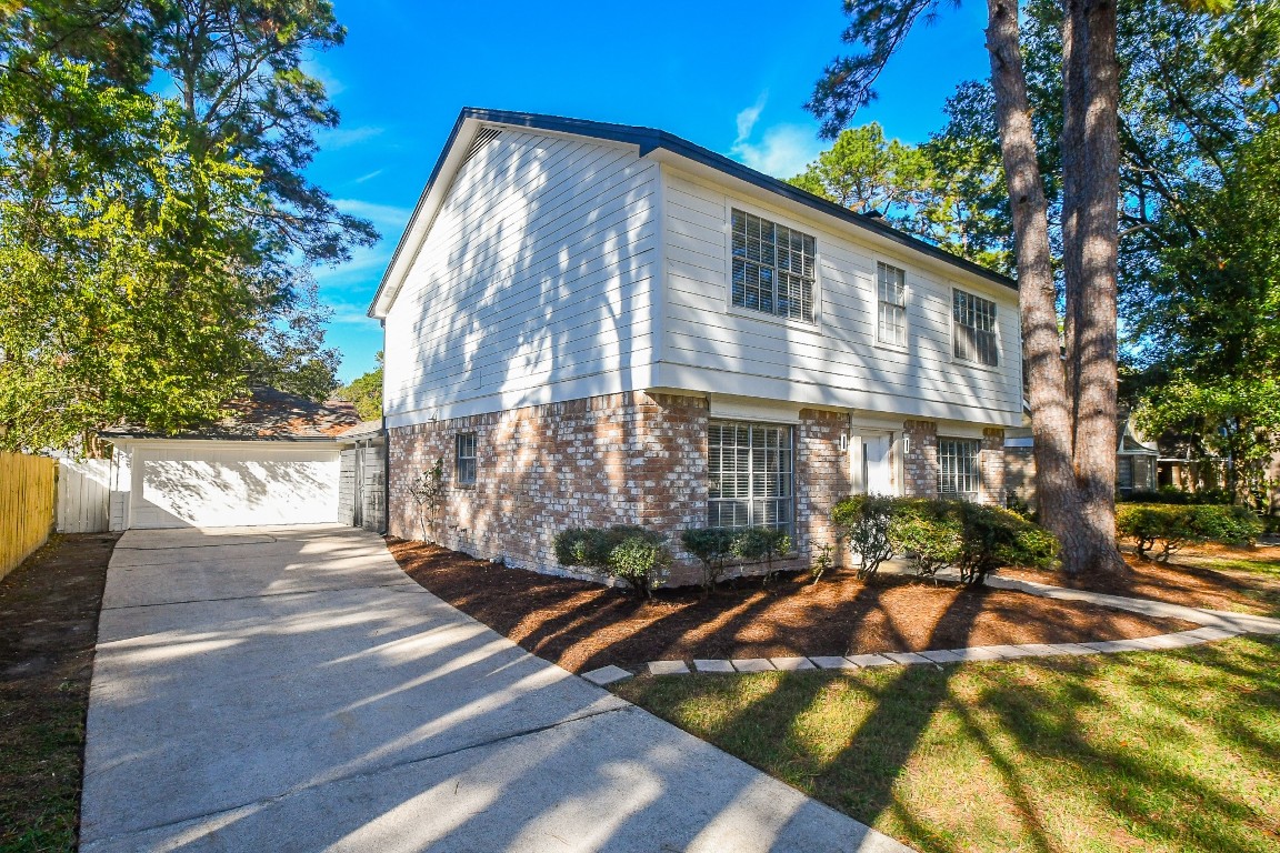 4730 Theall Road Houston, TX 77066 - Photo 2 of 32 a view of a house with a yard