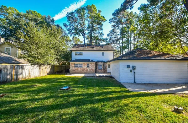 a view of house with backyard porch