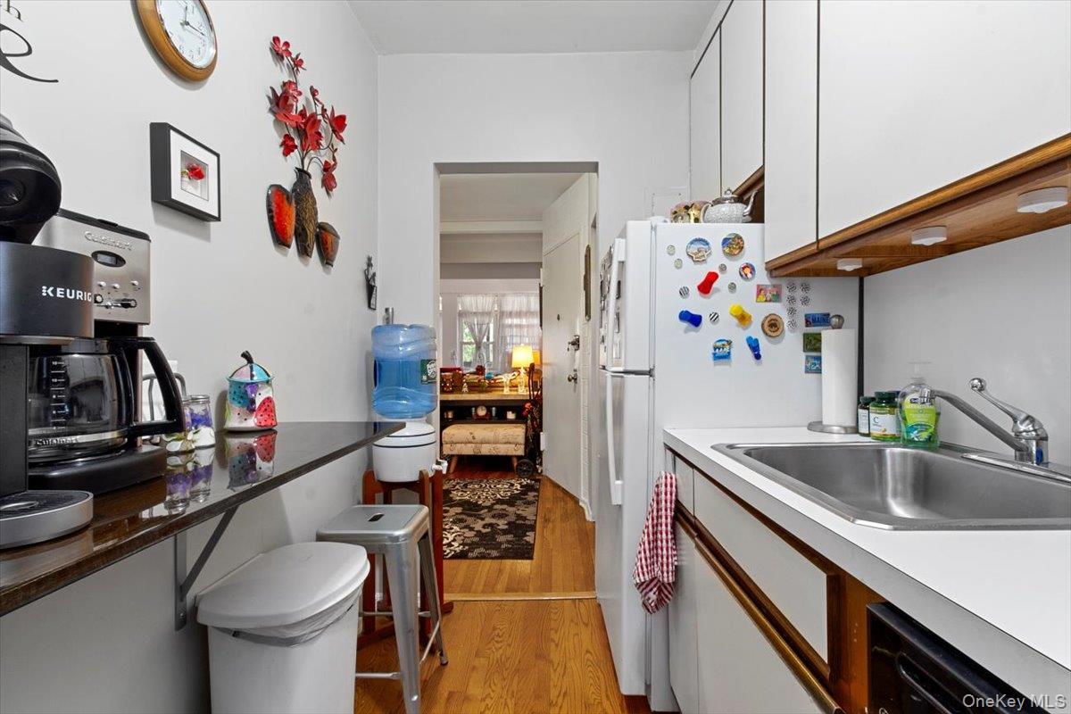 103 Wiltshire Road, Unit D11 Scarsdale, NY 10583 - Photo 18 of 23 a kitchen with a sink and appliances