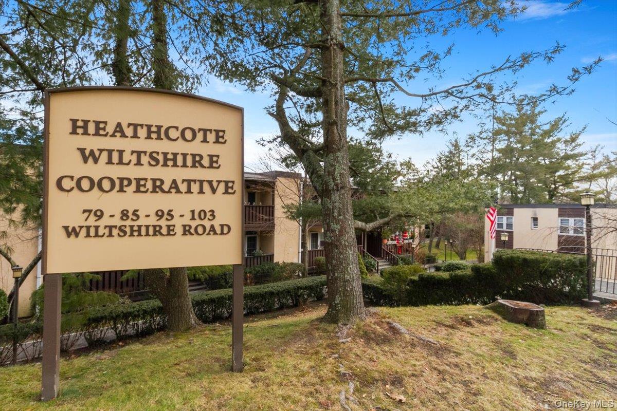 103 Wiltshire Road, Unit D11 Scarsdale, NY 10583 - Photo 2 of 23 a sign on the side of a road