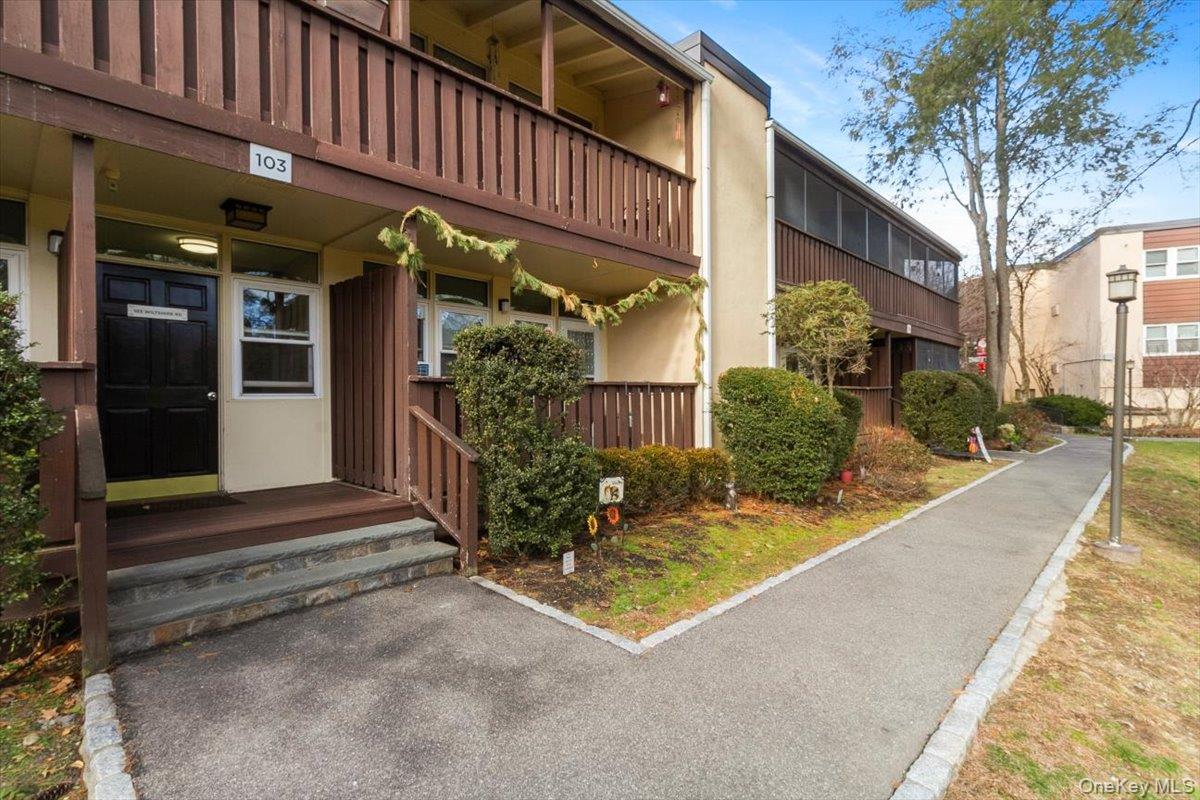 103 Wiltshire Road, Unit D11 Scarsdale, NY 10583 - Photo 3 of 23 a view of a building with sitting area