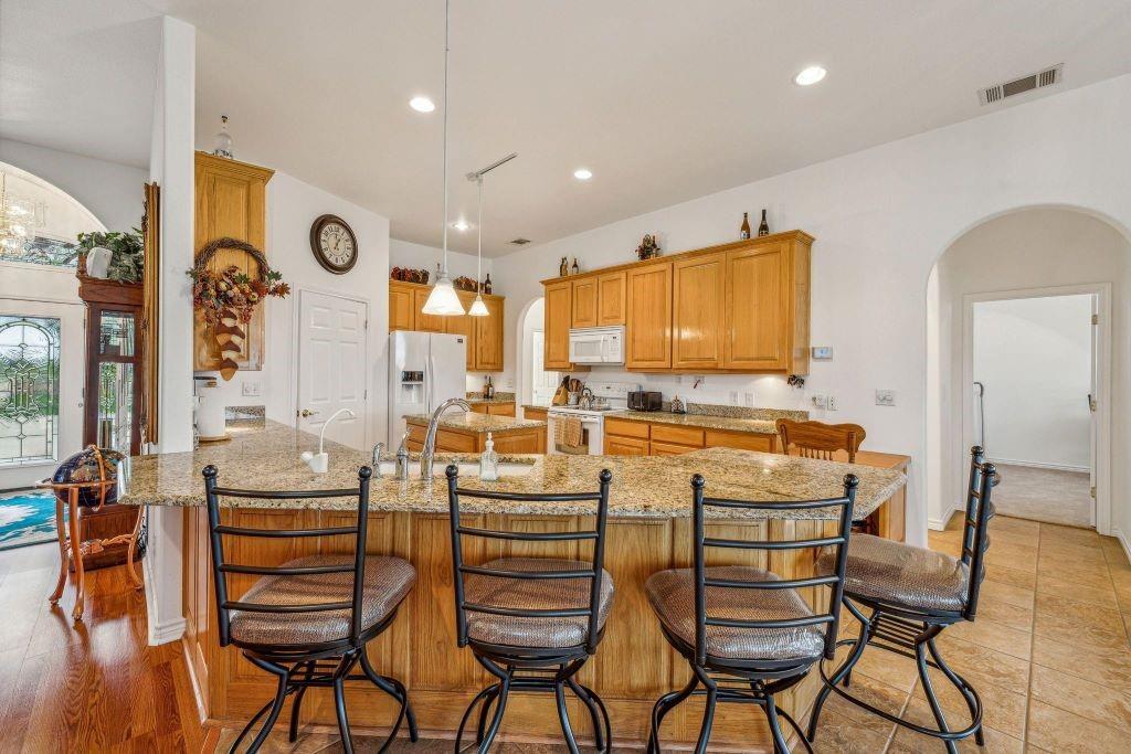 641 Comanche Lake Road Comanche, TX 76442 - Photo 11 of 34 a large kitchen with a table and chairs