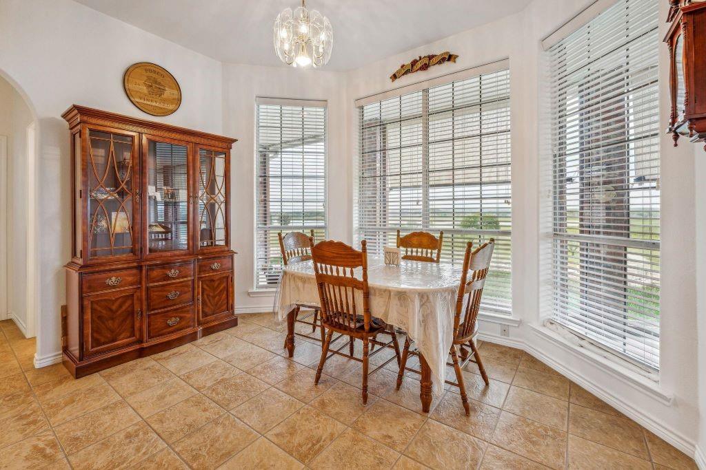 641 Comanche Lake Road Comanche, TX 76442 - Photo 13 of 34 a view of a dining room with furniture and window