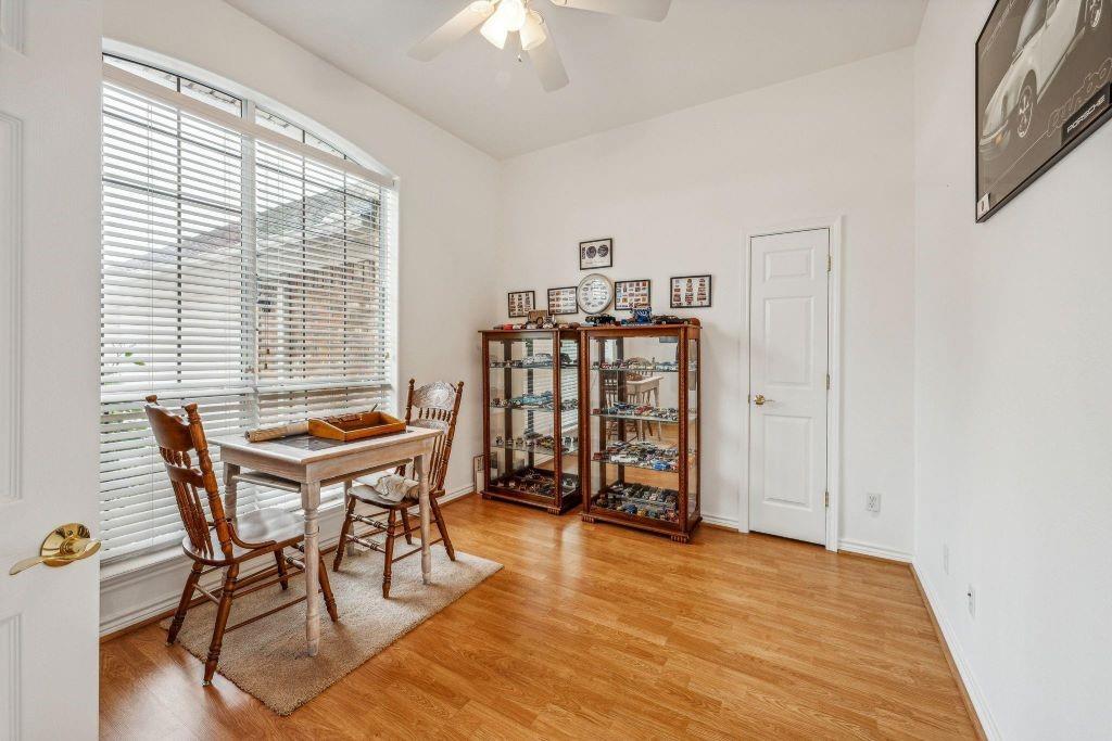 641 Comanche Lake Road Comanche, TX 76442 - Photo 15 of 34 a dining room with furniture and wooden floor