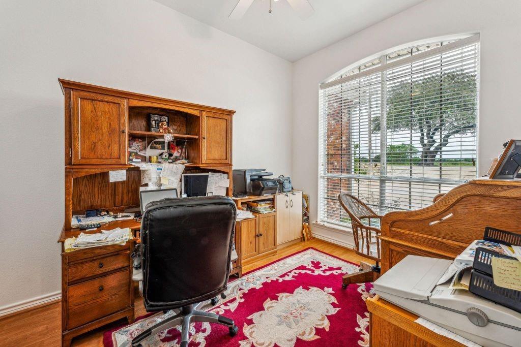 641 Comanche Lake Road Comanche, TX 76442 - Photo 16 of 34 a living room with furniture and a table
