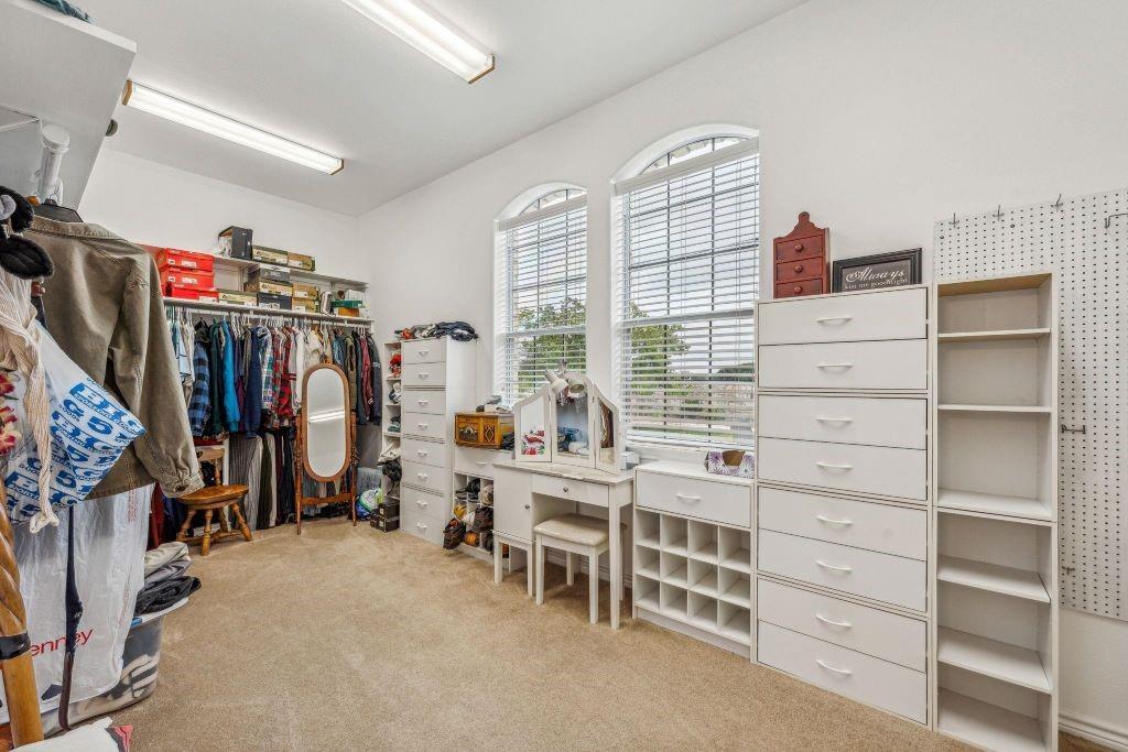 641 Comanche Lake Road Comanche, TX 76442 - Photo 21 of 34 a view of walk in closet with clothes and shoes