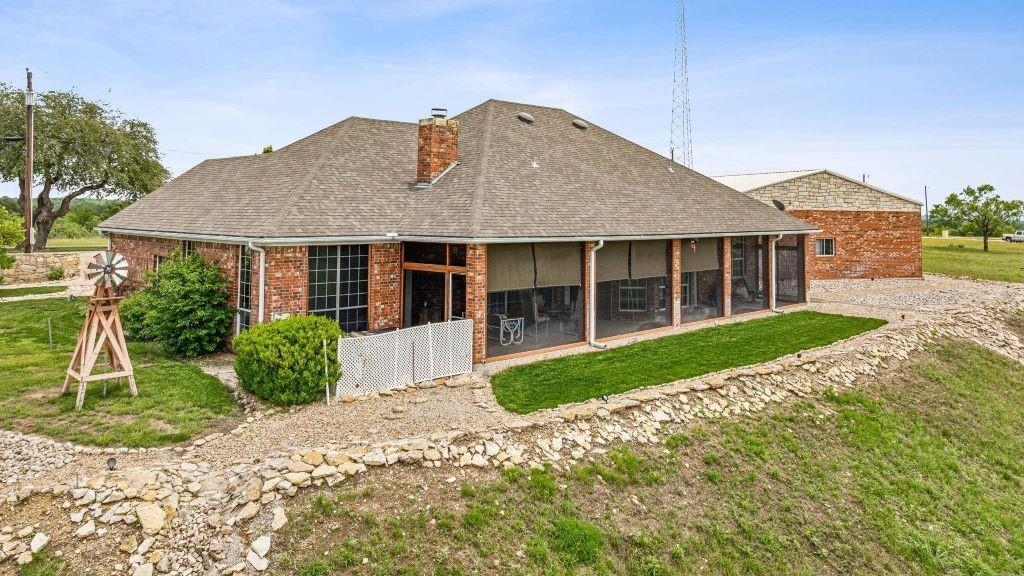 641 Comanche Lake Road Comanche, TX 76442 - Photo 26 of 34 a front view of a house with a yard