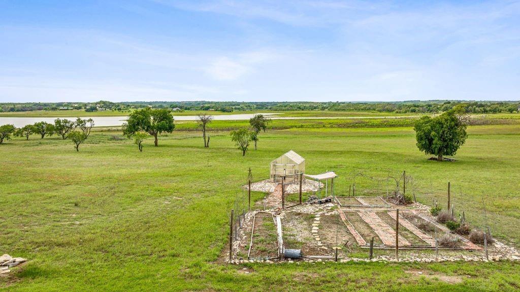 641 Comanche Lake Road Comanche, TX 76442 - Photo 29 of 34 a view of a lake with a big yard