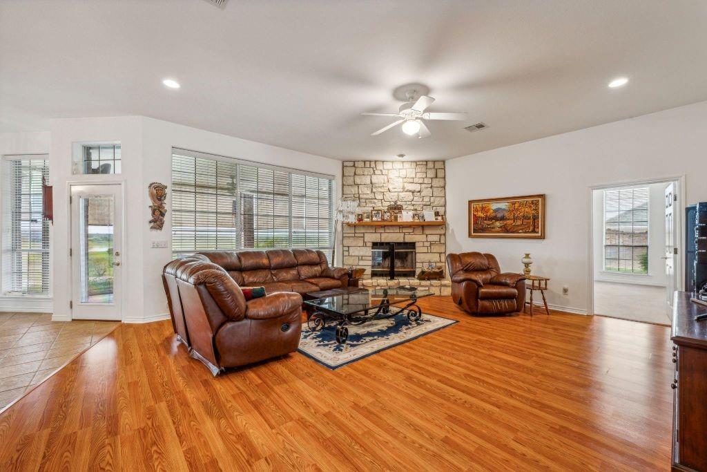 641 Comanche Lake Road Comanche, TX 76442 - Photo 8 of 34 a living room with furniture and a wooden floor