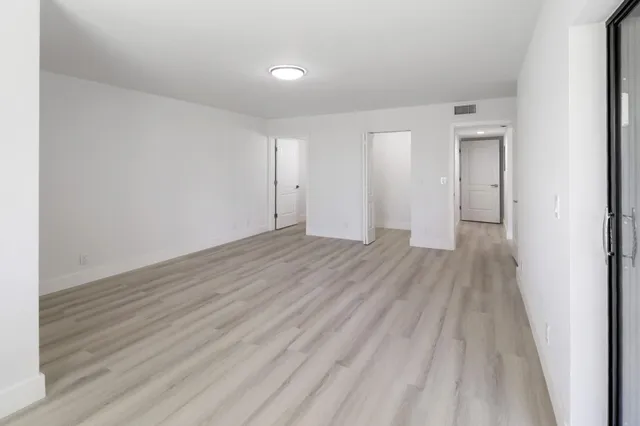 a bathroom with a double vanity sink mirror and toilet
