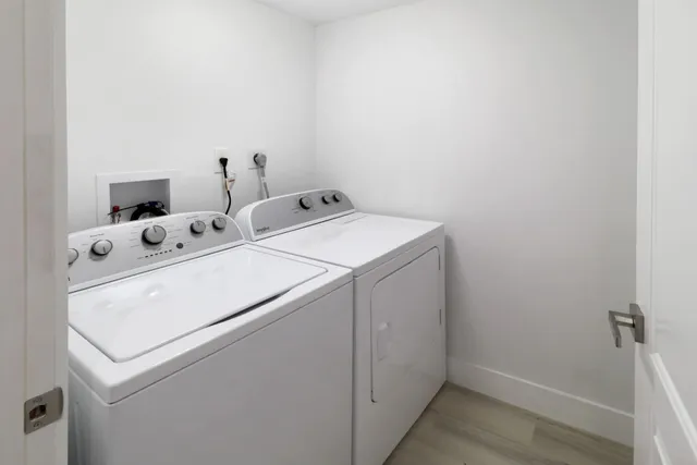 a living room with furniture a chandelier and a chandelier
