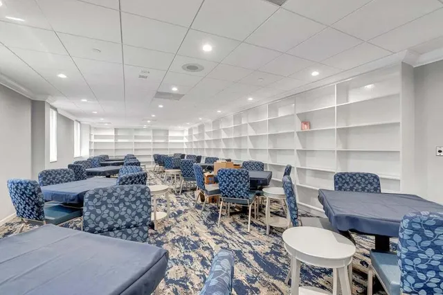 a view of a swimming pool with a yard