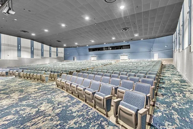 a living room with furniture a table tennis table