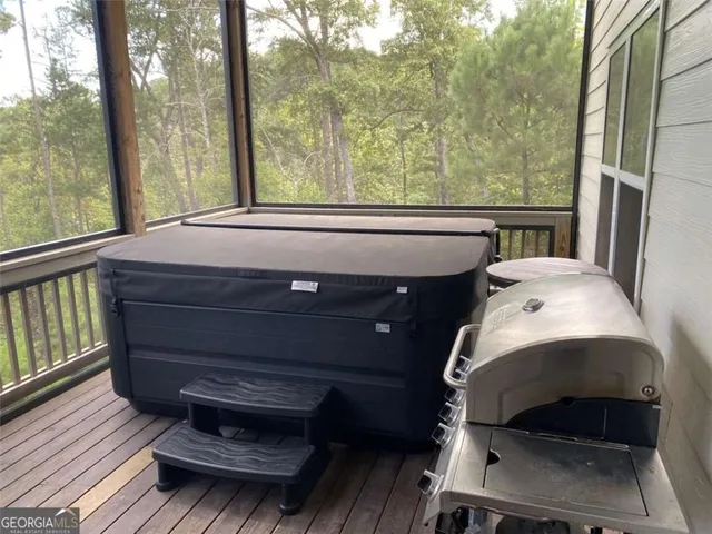 a bathroom with a granite countertop double vanity sink and a mirror