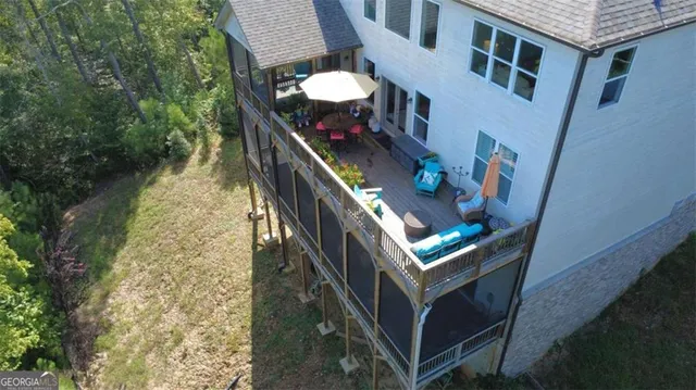 a view of walk in closet with clothes