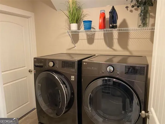 a balcony with furniture and a potted plant