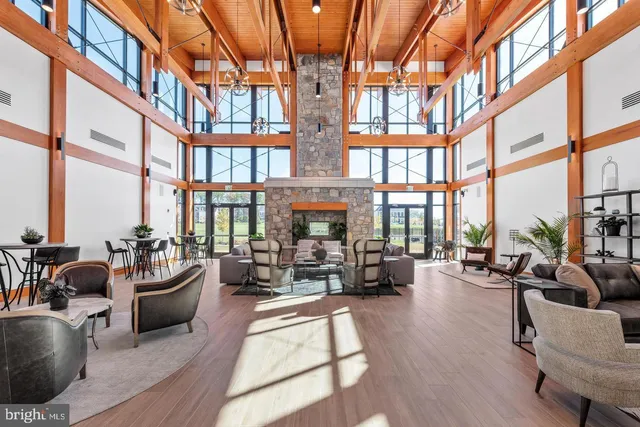 a living room with furniture or floor to ceiling windows and a large window