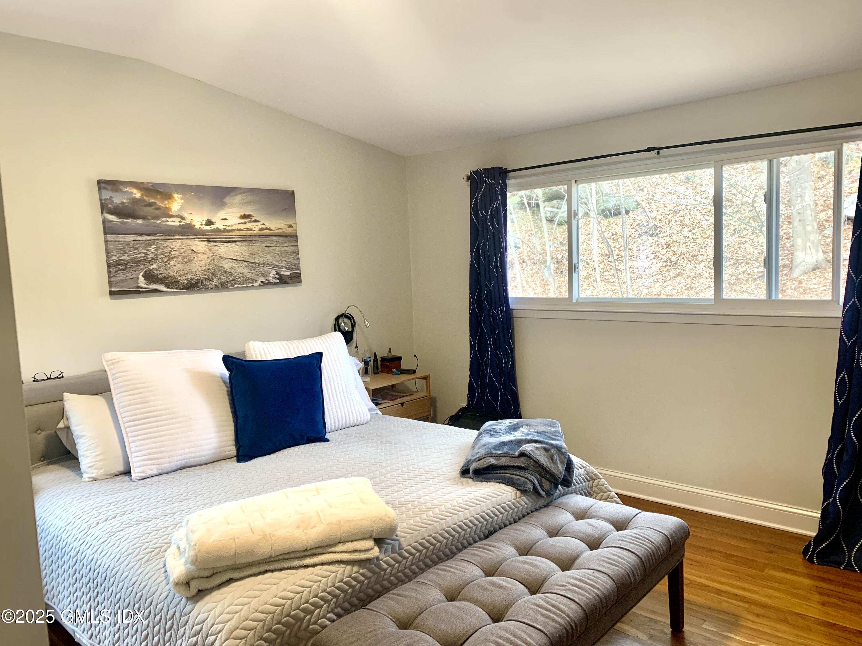 67 Florence Road Riverside, CT 06878 - Photo 11 of 23 a bedroom with a bed and a window