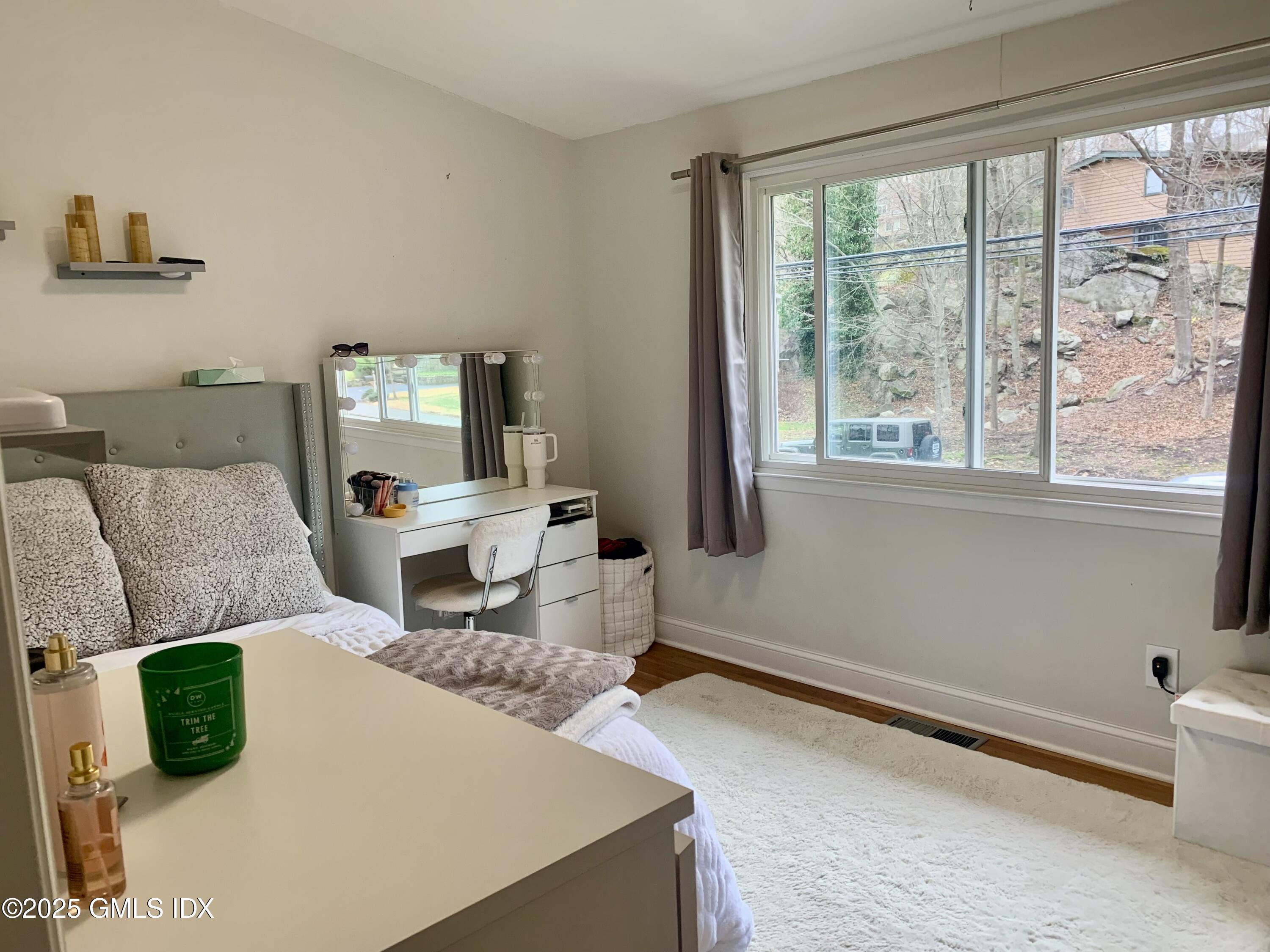 67 Florence Road Riverside, CT 06878 - Photo 14 of 23 a living room with furniture and a large window