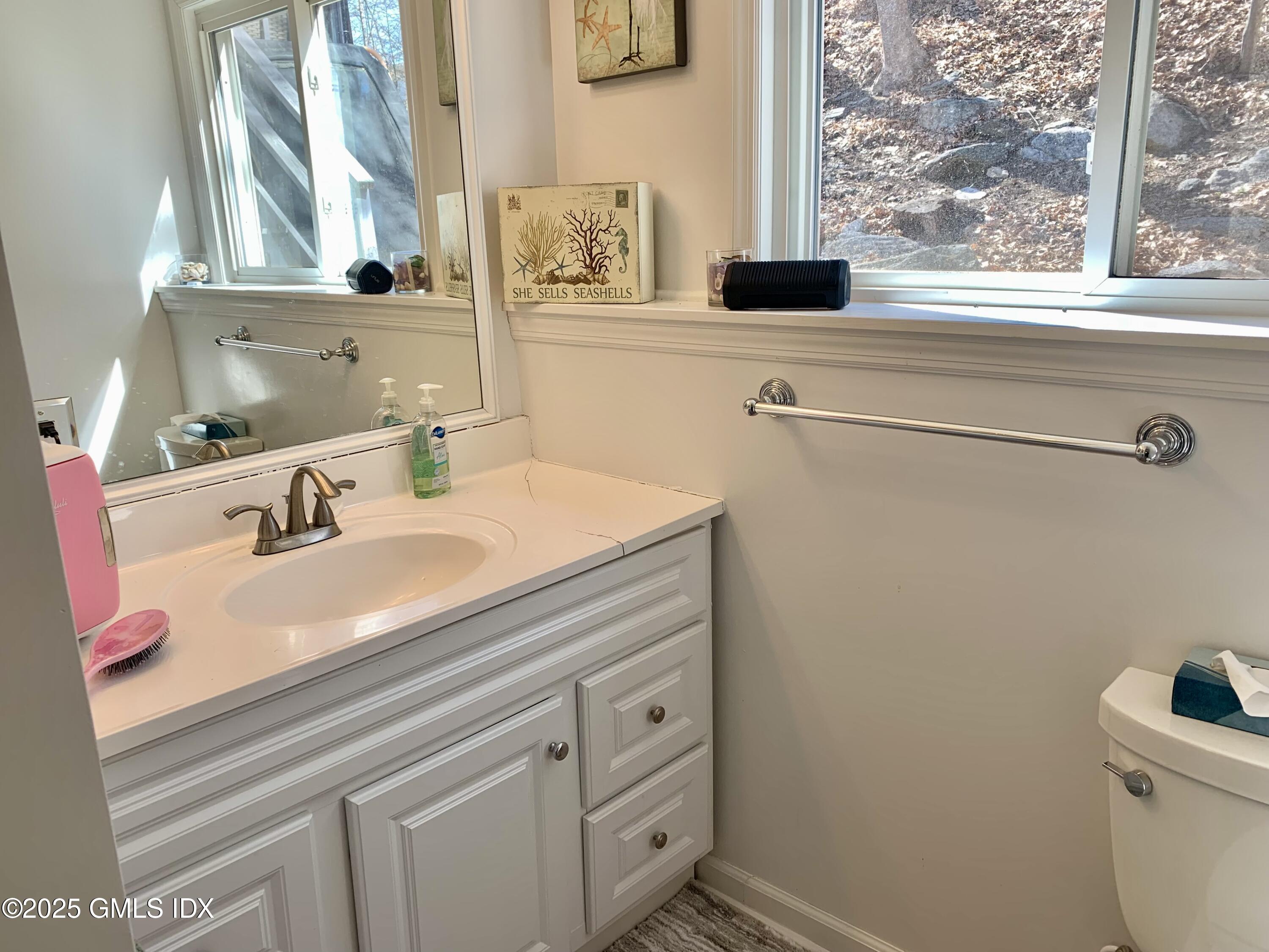 67 Florence Road Riverside, CT 06878 - Photo 15 of 23 a bathroom with a sink and a window