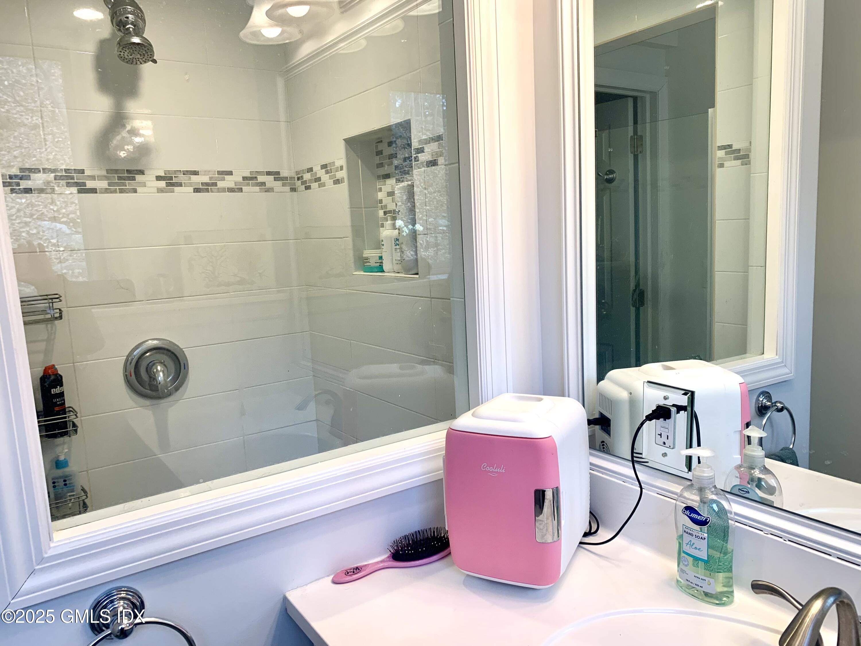 67 Florence Road Riverside, CT 06878 - Photo 17 of 23 a bathroom with a tub shower and sink