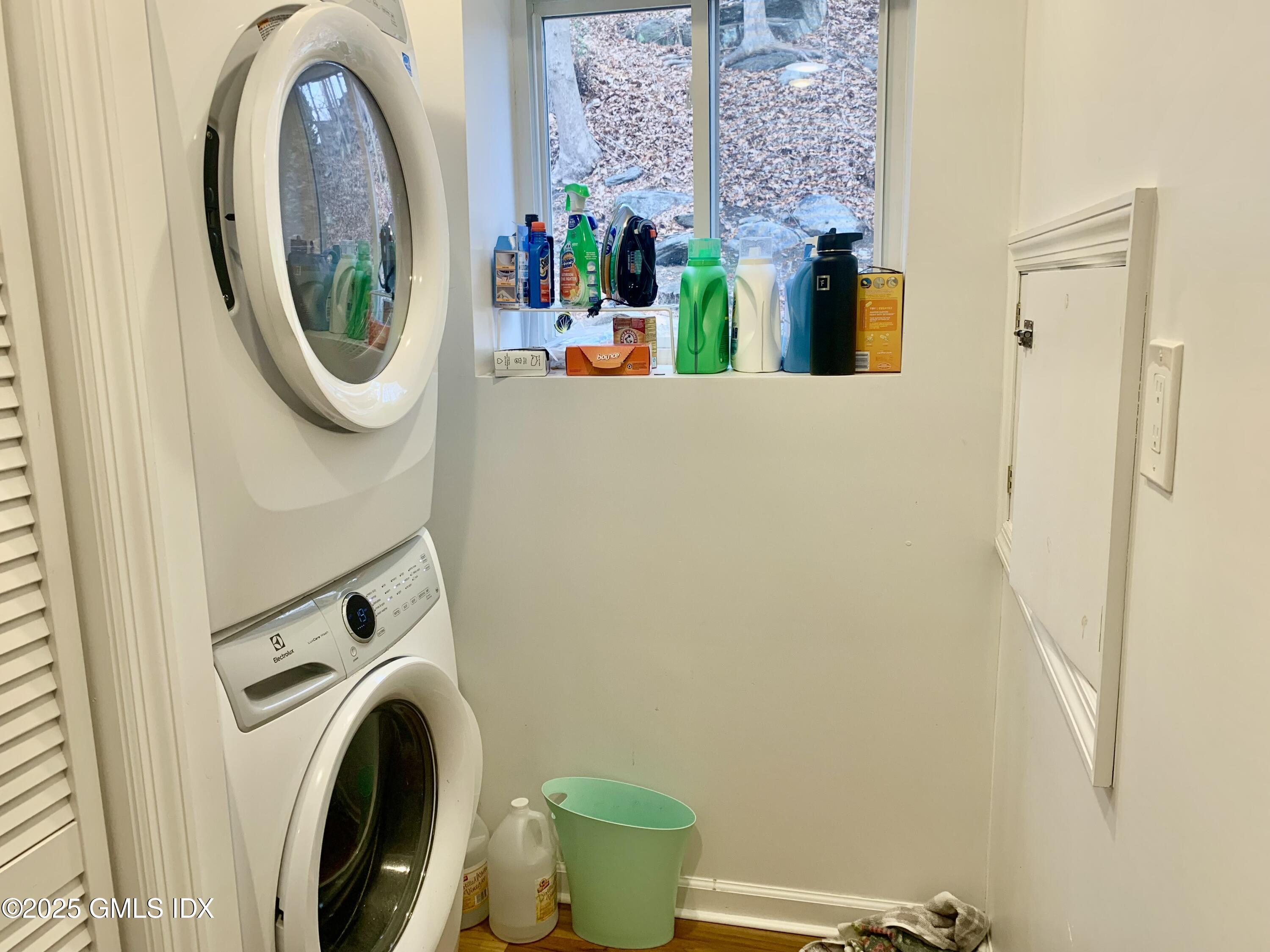 67 Florence Road Riverside, CT 06878 - Photo 18 of 23 a view of a storage and utility room with a washer and dryer